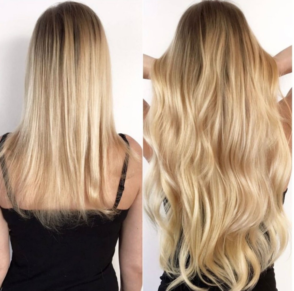 Before and after from behind: shoulder-length straight blonde with roots to waist-length voluminous wavy blonde