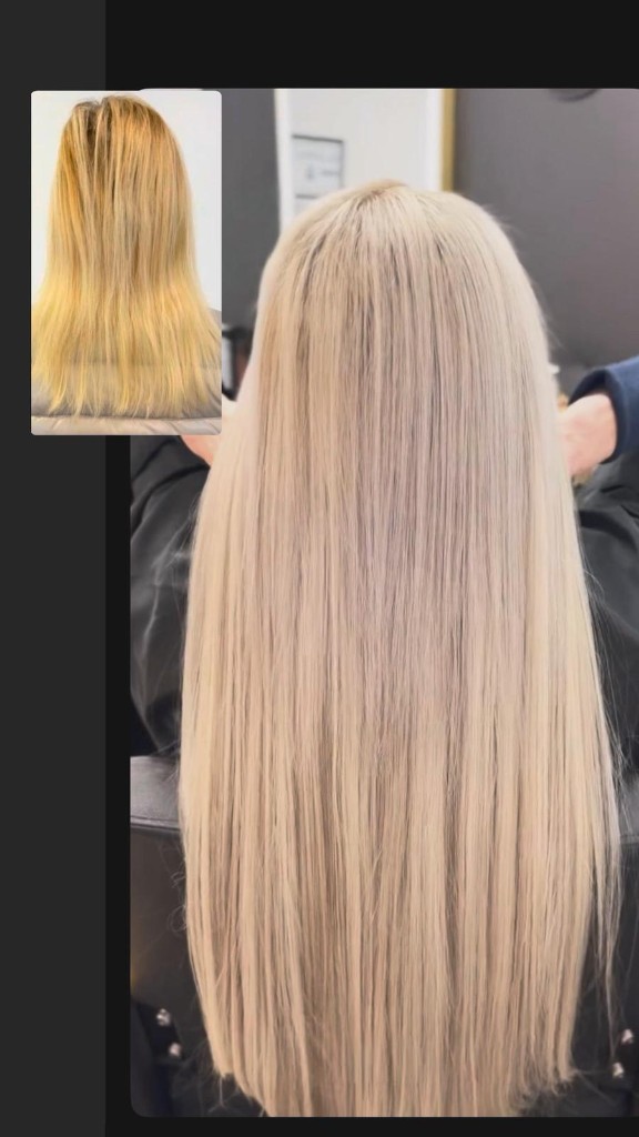 Before inset and after: brassy blonde corrected to cool ash platinum, long straight hair from behind in the salon